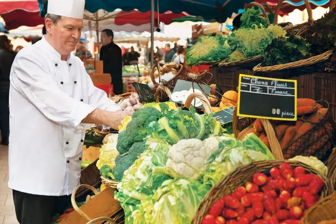 Chef choosing organic produce at a market